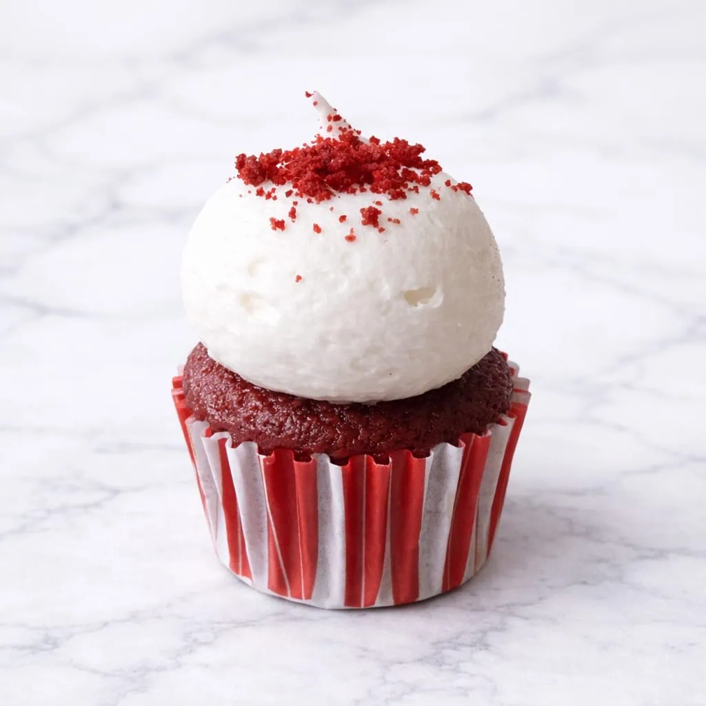 Mini Red Velvet cupcake with cream cheese frosting.