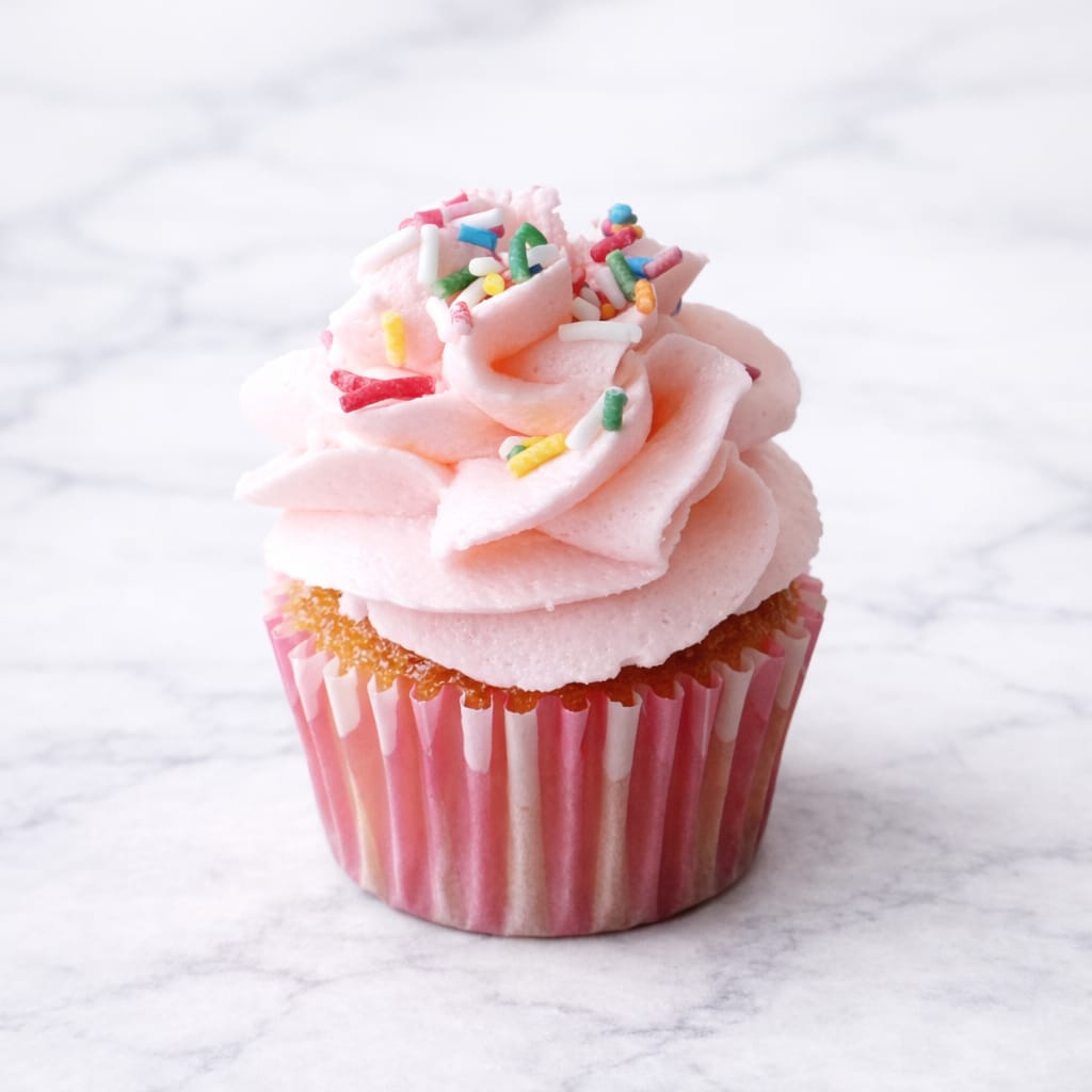 Mini vanilla cupcake with vanilla buttercream frosting.