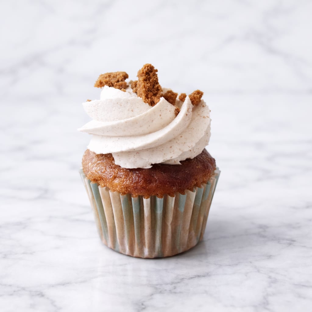 Vegan Mini speculoos cupcake topped with speculoos cookie crumbles.