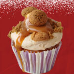 Sinterklaas gingerbread speculaas cupcake with spiced frosting, caramel drizzle, and kruidnootjes
