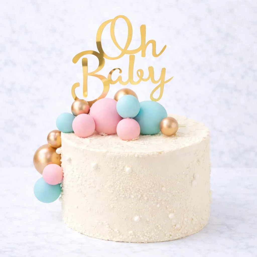 Gender reveal vanilla layer cake with optional blue or pink buttercream filling, designed for a reveal party.