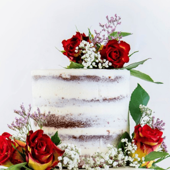 Semi-naked red velvet wedding cake with real flowers from Ten Three Bakery