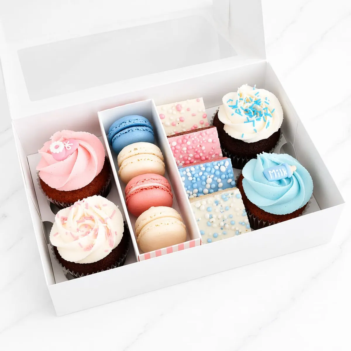Newborn Baby Celebration Gift Box containing cupcakes, macarons, brownies, and cakepops in 'It's a Boy,' 'It's a Girl,' or