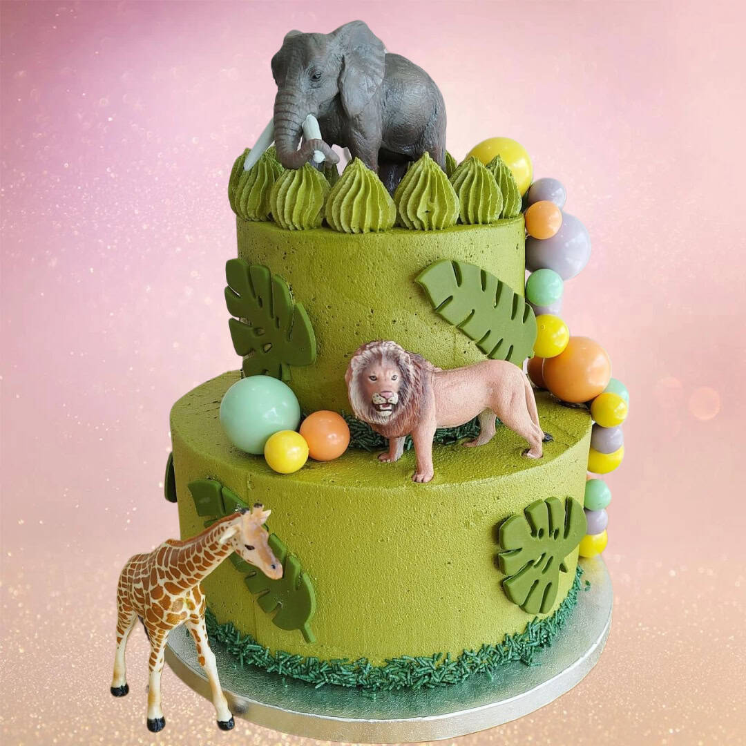 ungle Party Cake with Green Buttercream and Animal Toppers