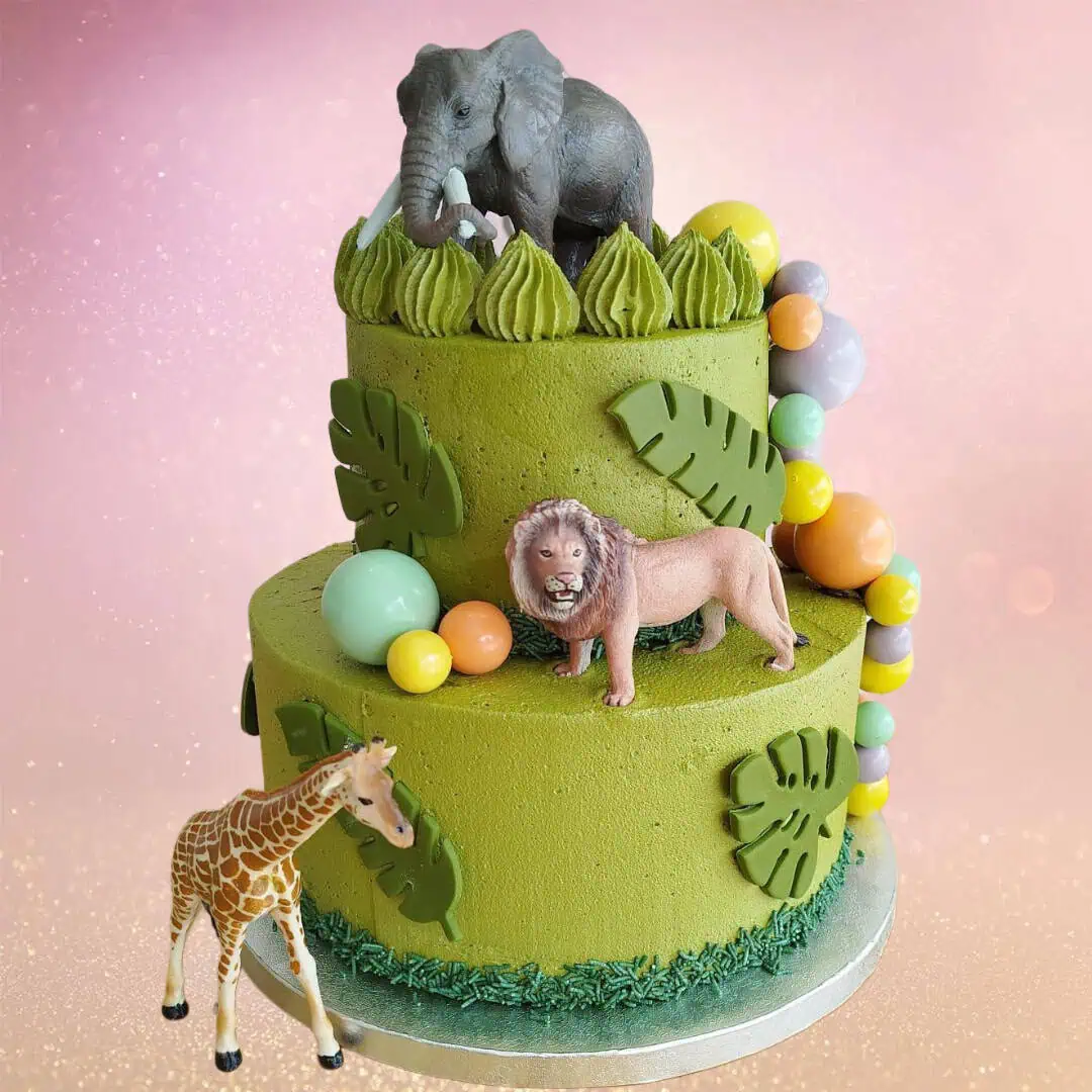 ungle Party Cake with Green Buttercream and Animal Toppers