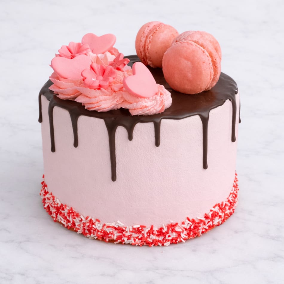 Macaron drip cake with pure chocolate drip and macaron toppings.