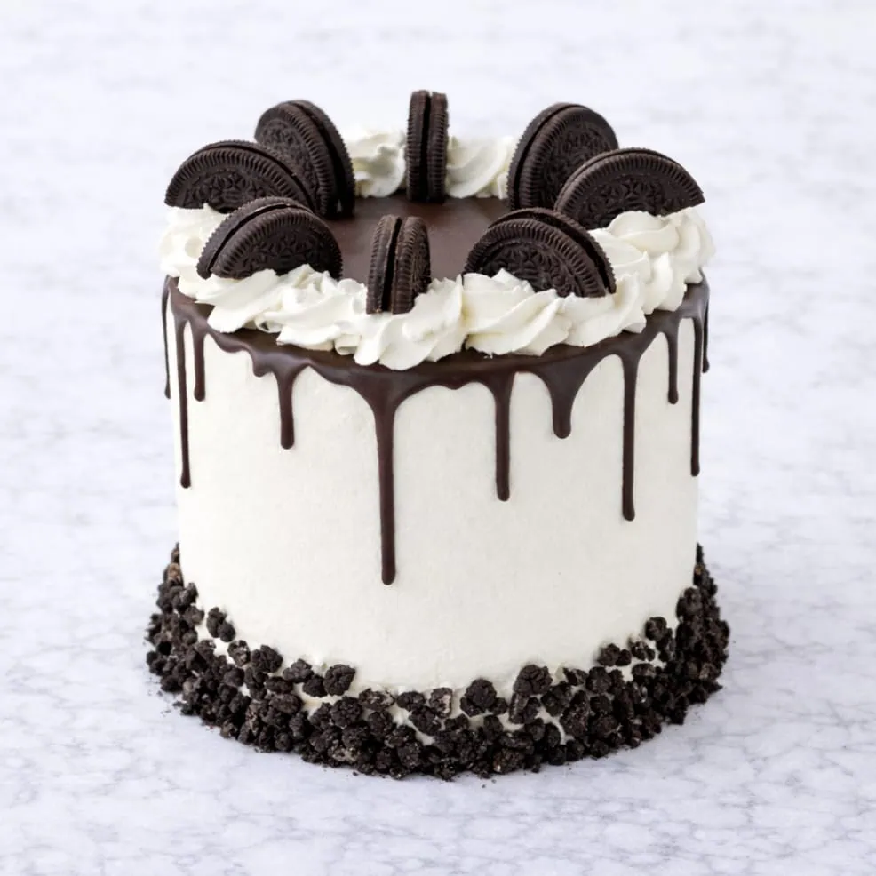 Oreo drip cake with chocolate drip and mini Oreo decorations