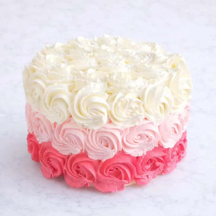 Romantic 3-layer rose dream layer cake in Vanilla & Strawberry or Red Velvet, available in white, pink, or ombre colors