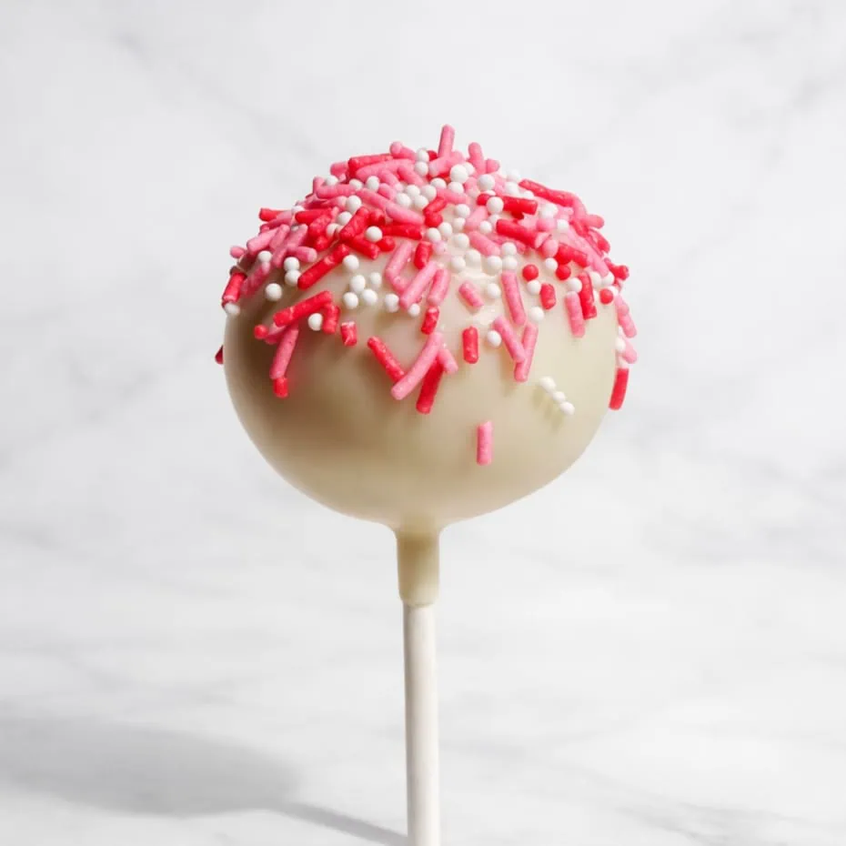 Red velvet cakepop dipped in white chocolate, decorated